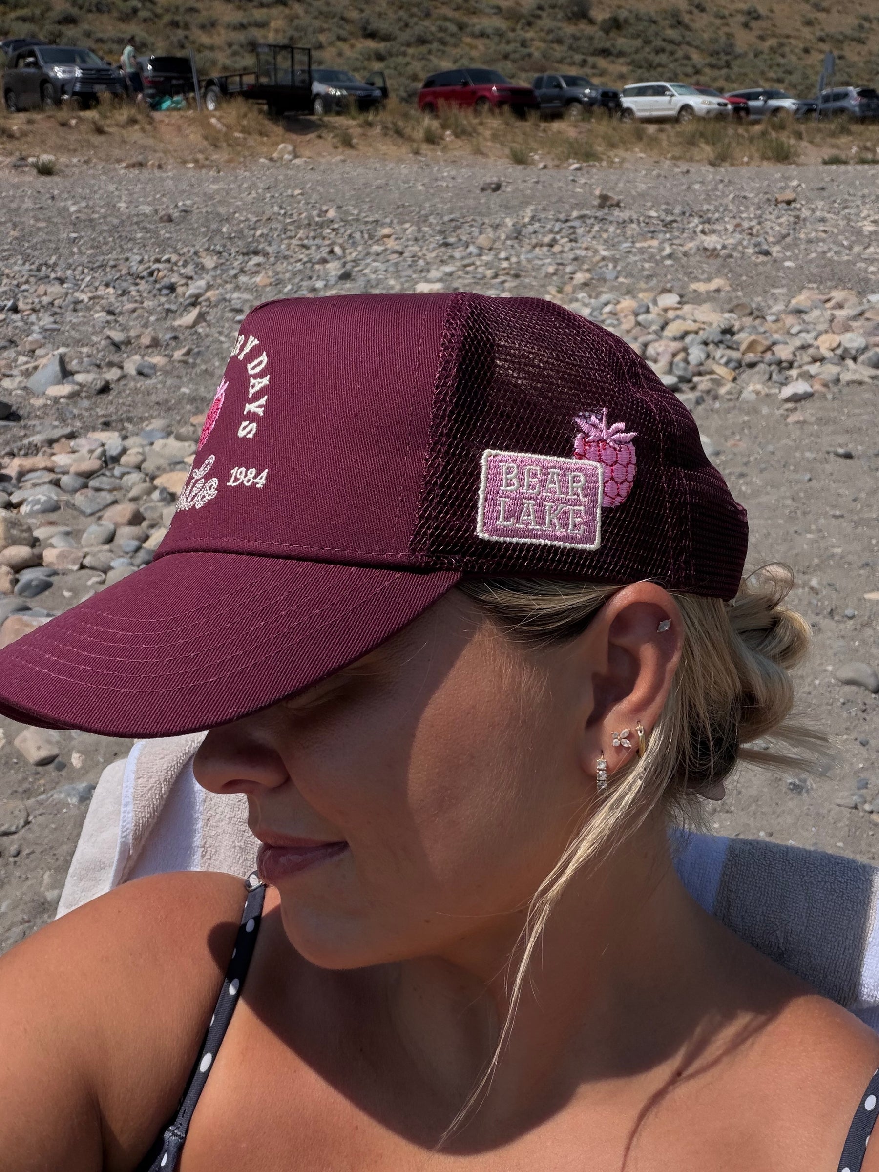 Close portrait of a Loud Face Raspberry Days rodeo cap being worn