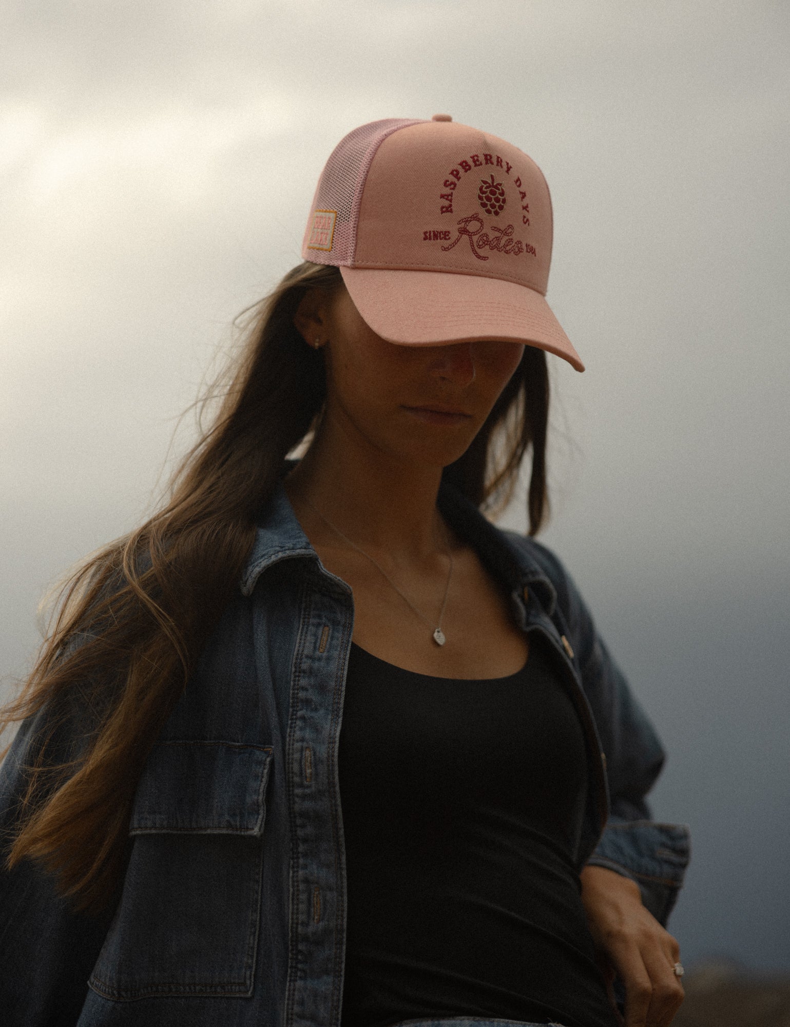 Portrait in a denim jacket and Loud Face cap